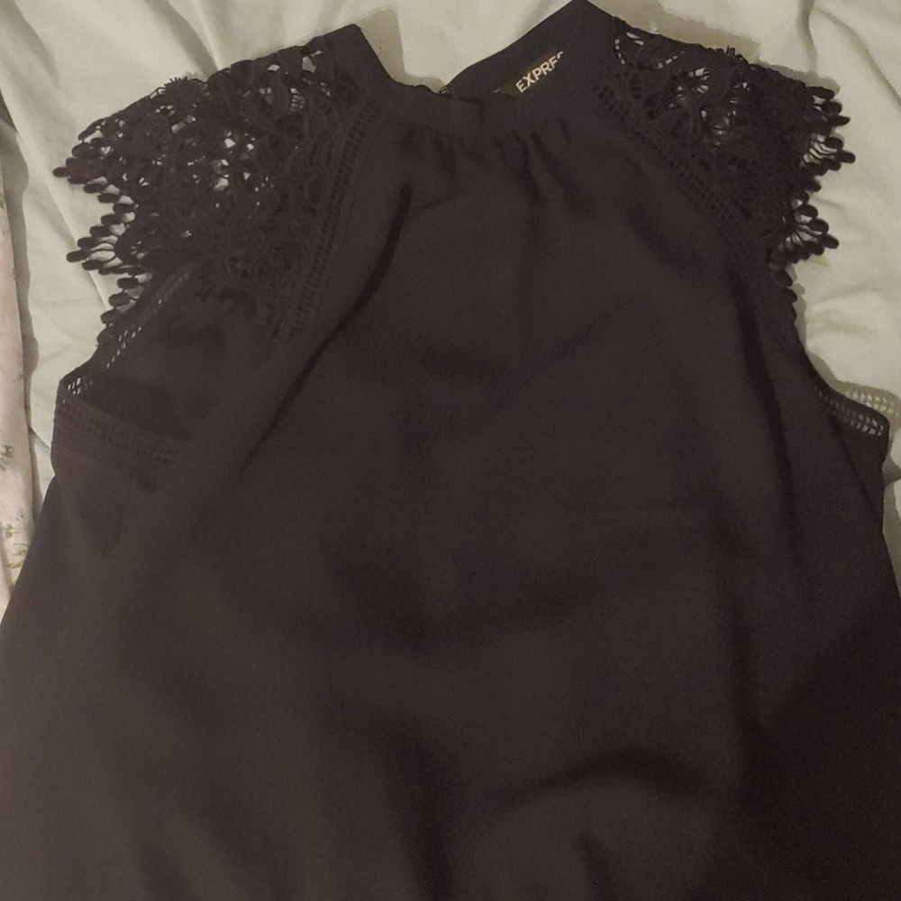 Black, lace, sleeveless blouse.
